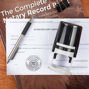 Arizona notary public stamp on affidavit with record book, pen, and self-inking stamp.