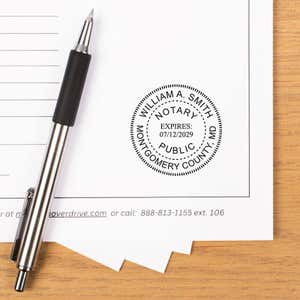 Notary stamp showing expiry date and registration number pressed onto paperwork