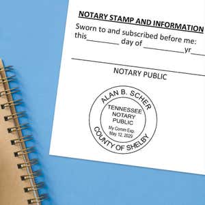 Notary public stamp impression on signed document above notebook