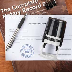Notary tool resting on a stamped certified document for legal records.