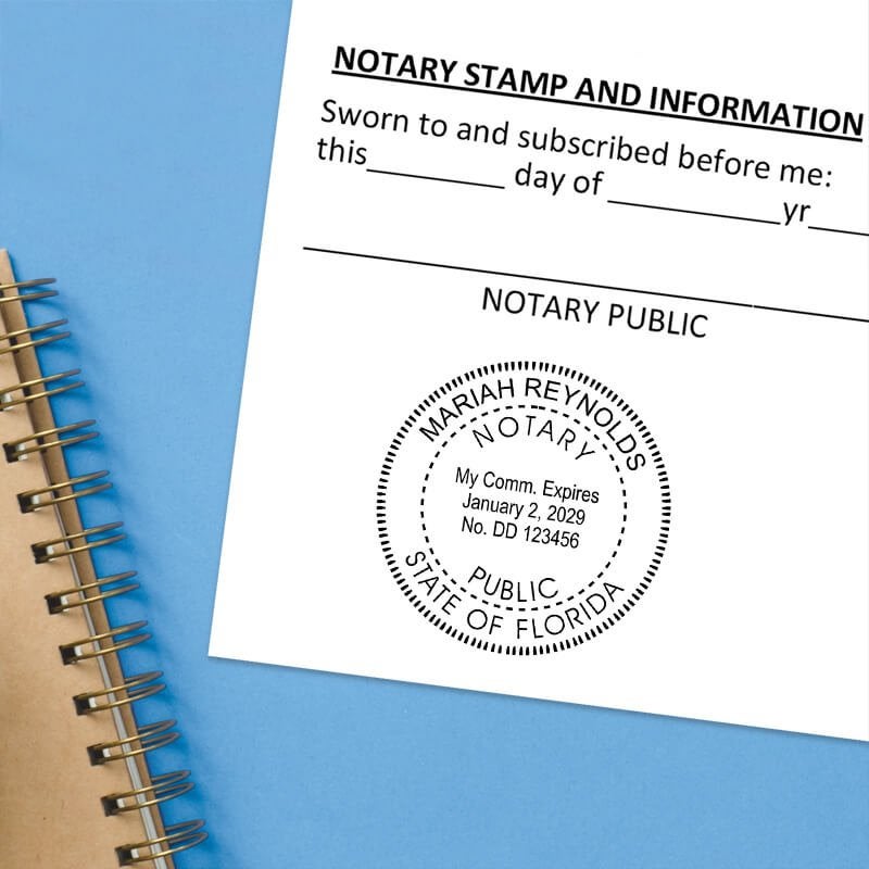 Florida notary seal impression on jurat form with spiral notebook on blue background.