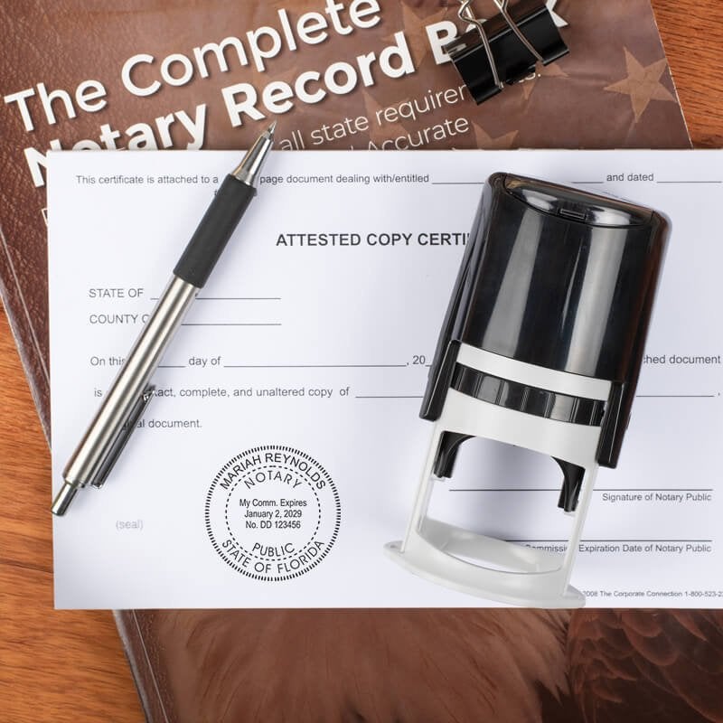 Florida notary stamp on affidavit with self-inking stamp, record book, and pen on wooden desk.