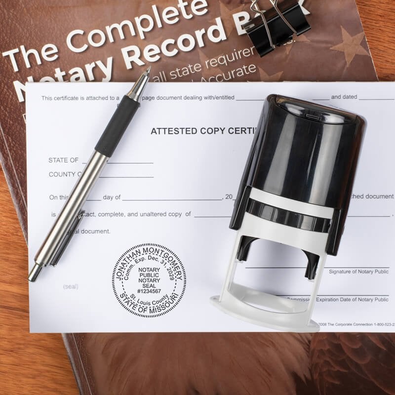 Missouri notary stamp on form with pen and record book on wood surface.