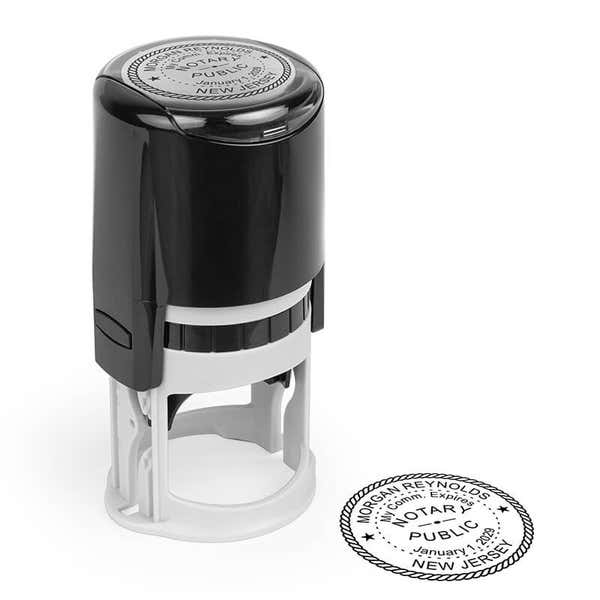 Round New Jersey notary stamp impression next to stamping tool