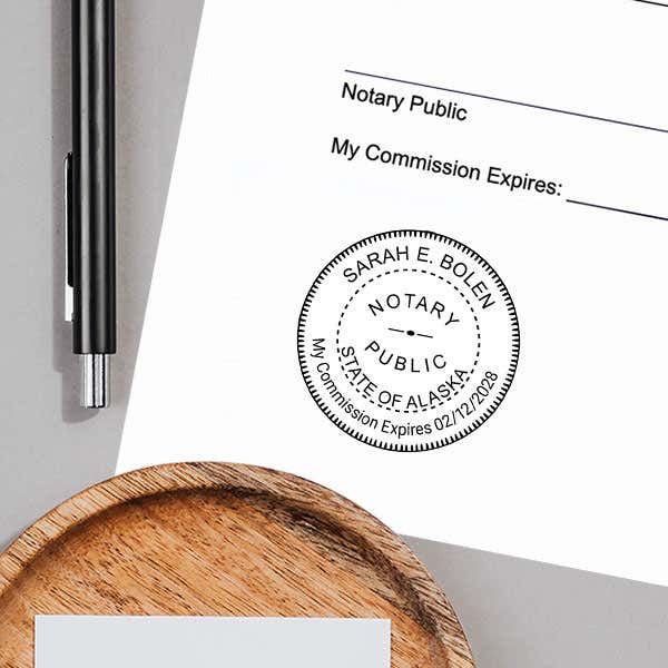 Depiction of Alaska Notary Pink Stamp Impression on Paper