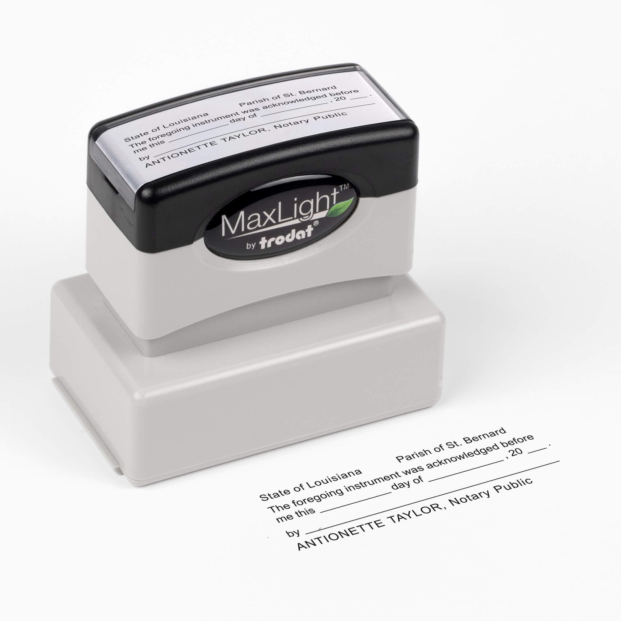 MaxLight pre-inked Louisiana notary stamp shown at a top angle with the sample acknowledgment impression below.