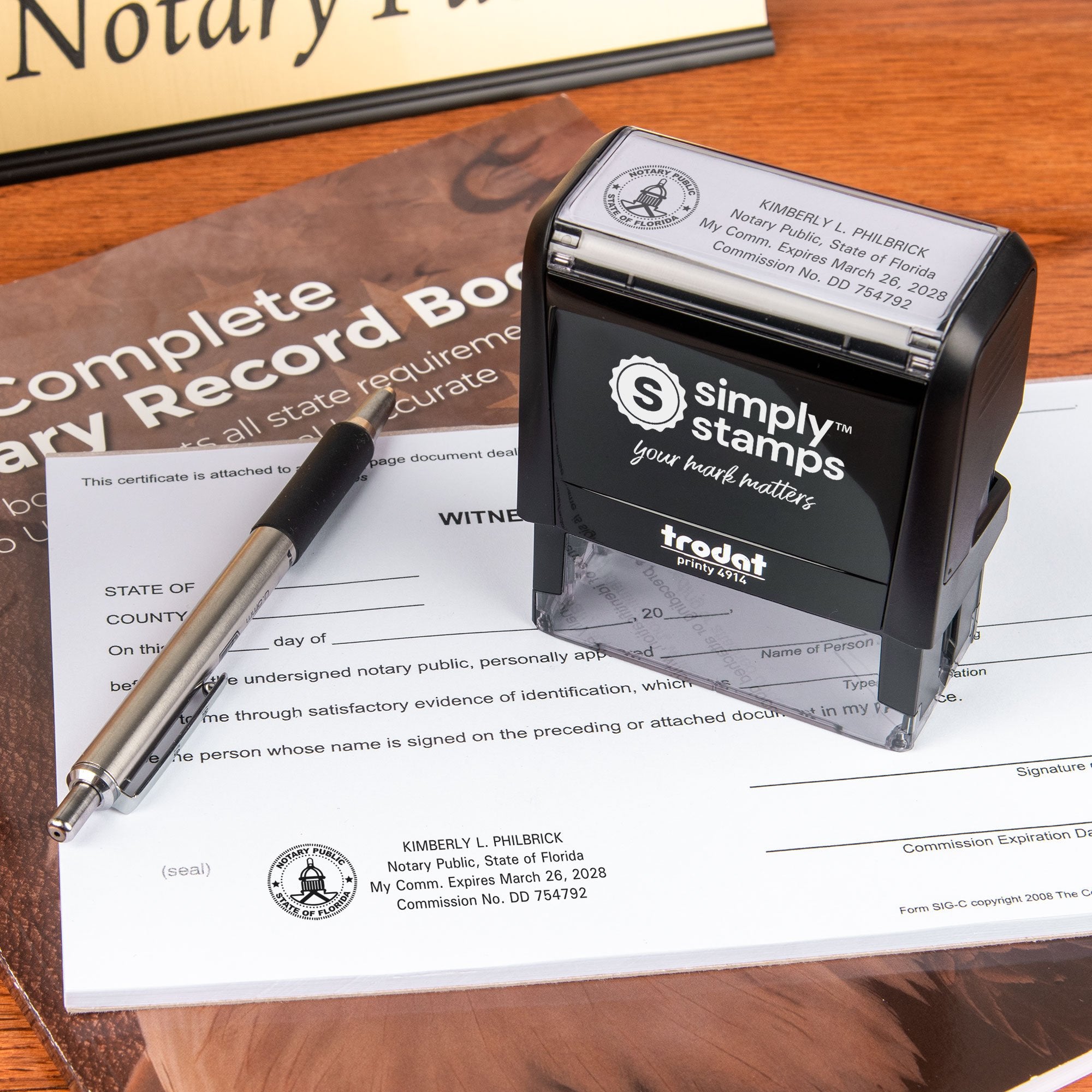 Professional notary workspace featuring a Florida notary stamp on legal paperwork and record books