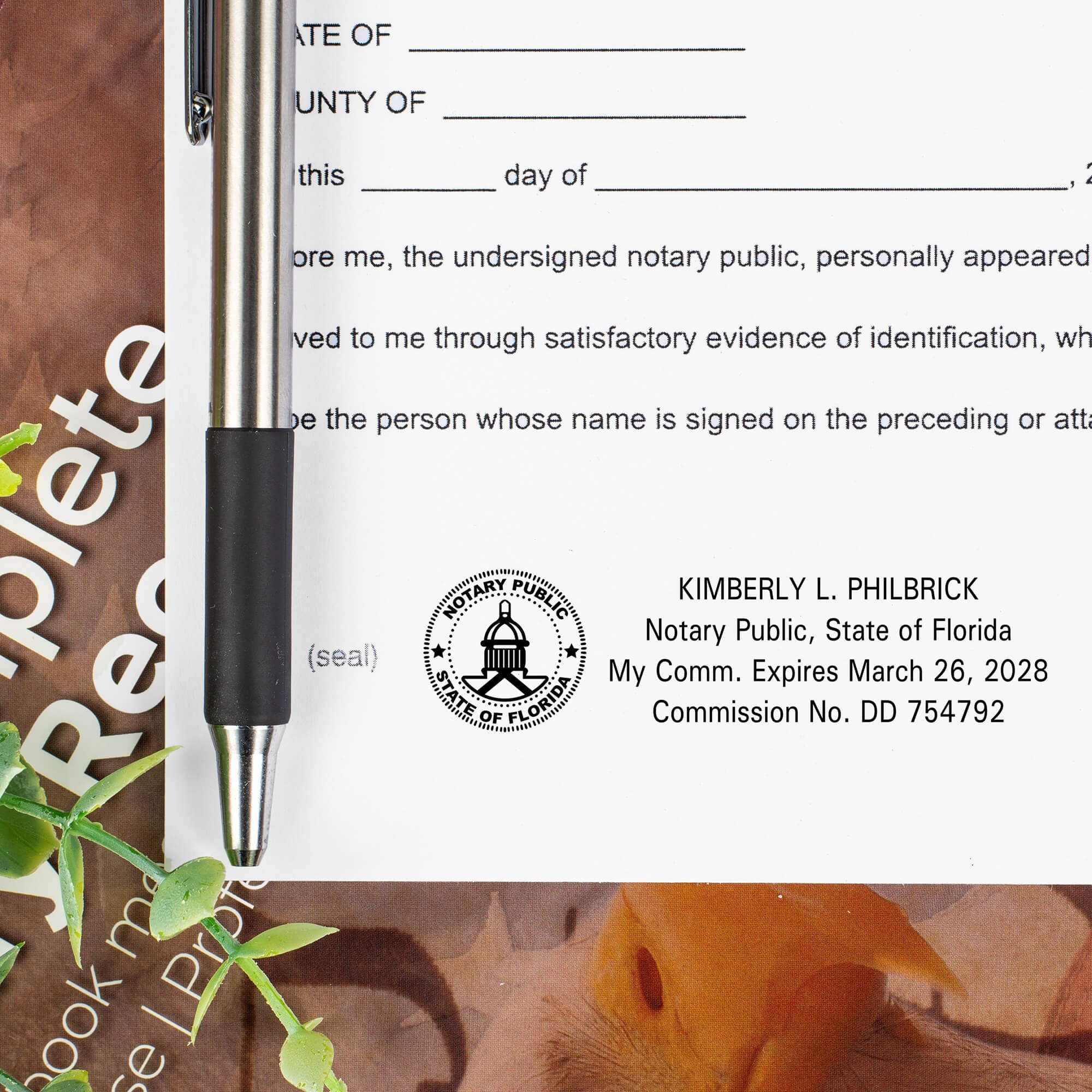 Close up of a Florida notary stamp impression showing required state seal and commission details