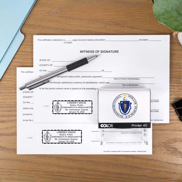 The Custom Massachusetts Notary Stamp with a personal logo on a document 