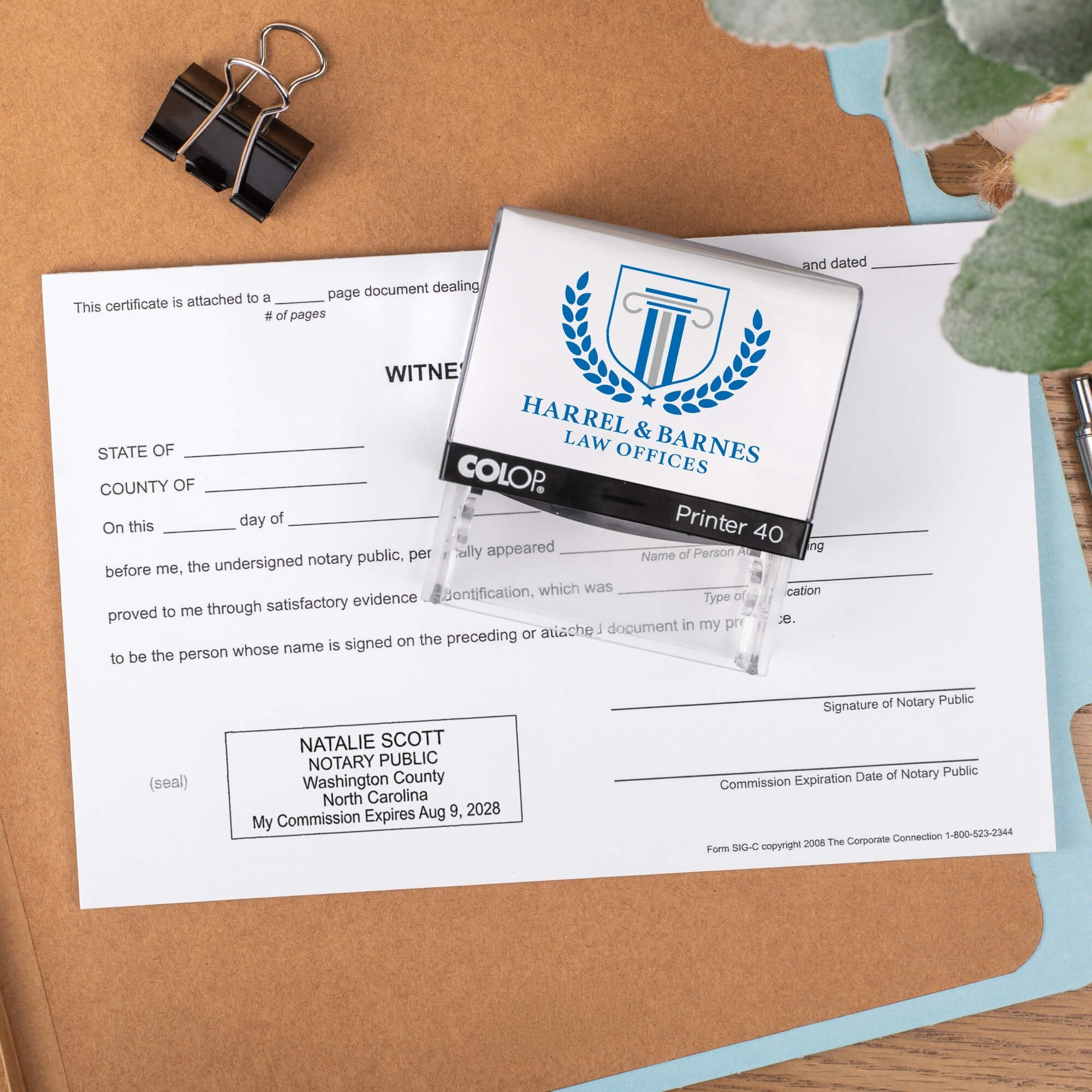 The Custom North Carolina Notary Stamp for a law office being used on a document