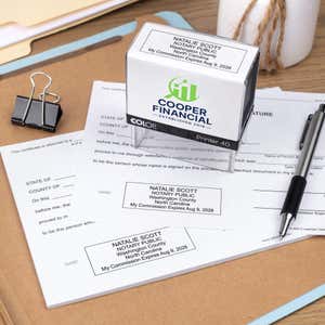 The Custom North Carolina Notary Stamp being used on two documents