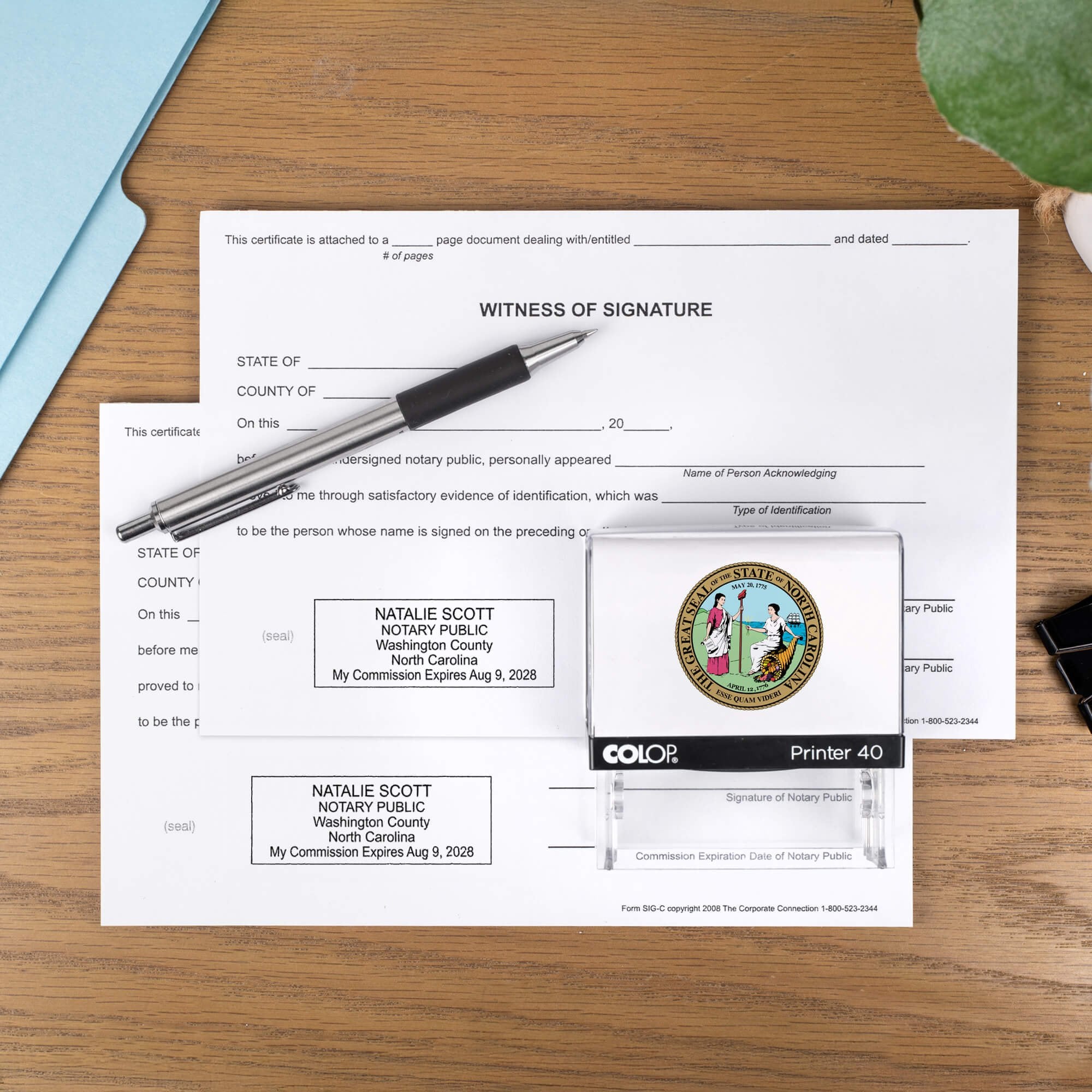 The Custom North Carolina Notary Stamp with a personal logo on two documents