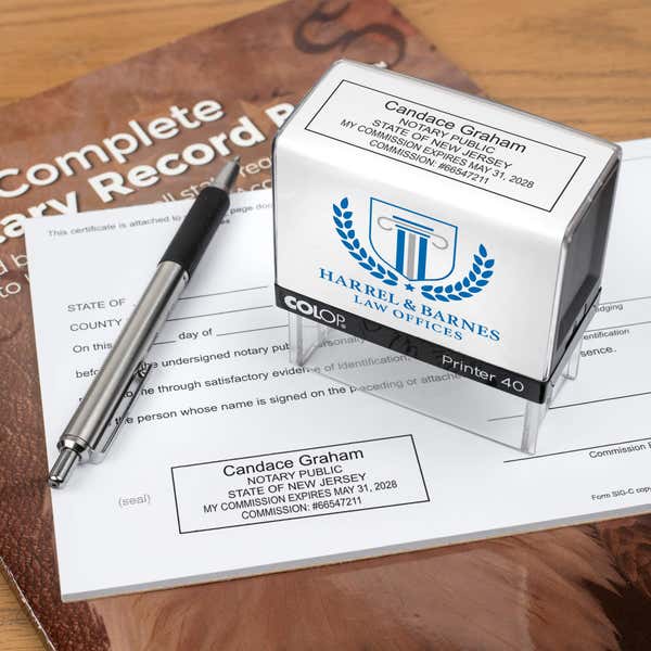 The Custom New Jersey Notary Stamp for a law office being used on a small document