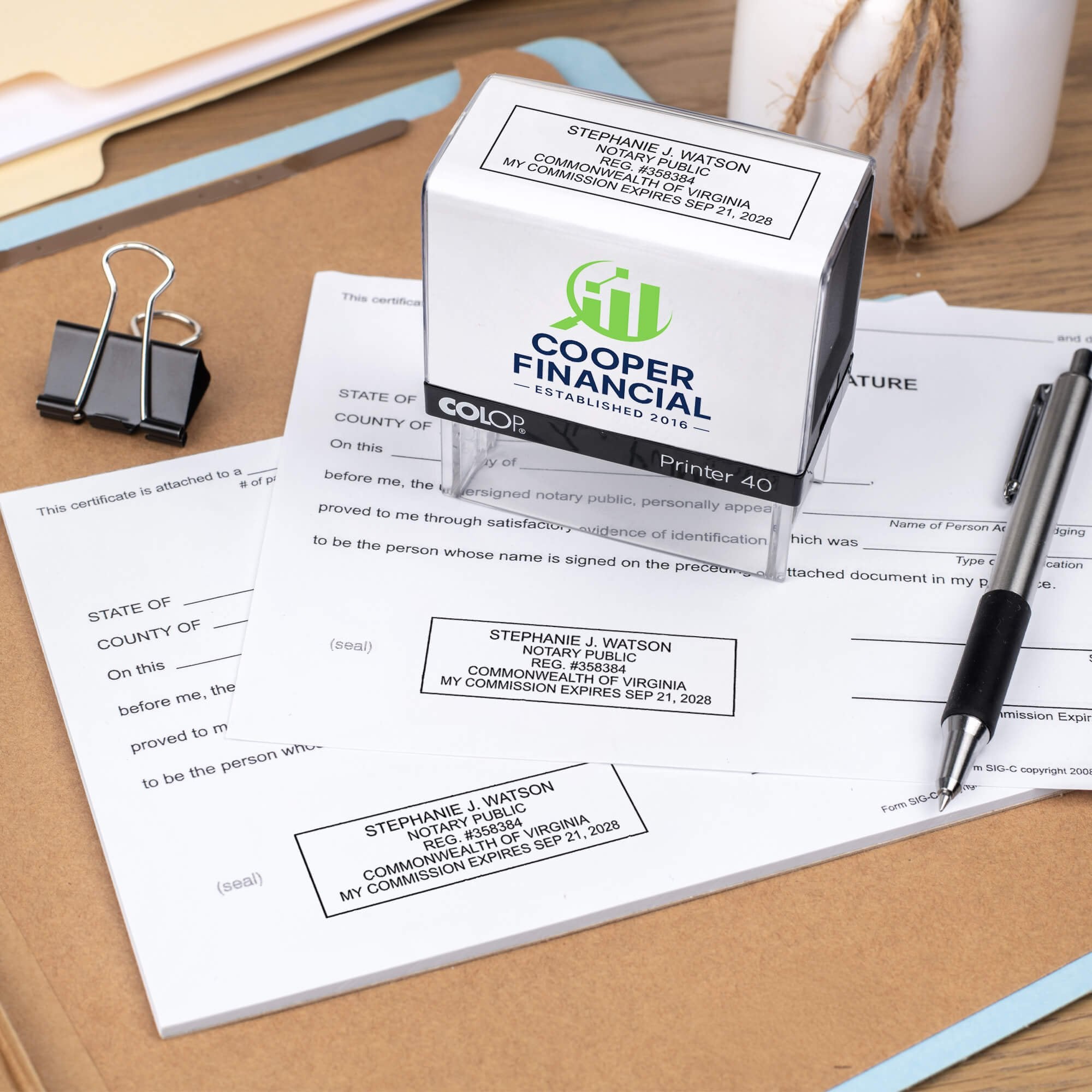 The custom Virginia Notary Stamp for a financial office being used on documents