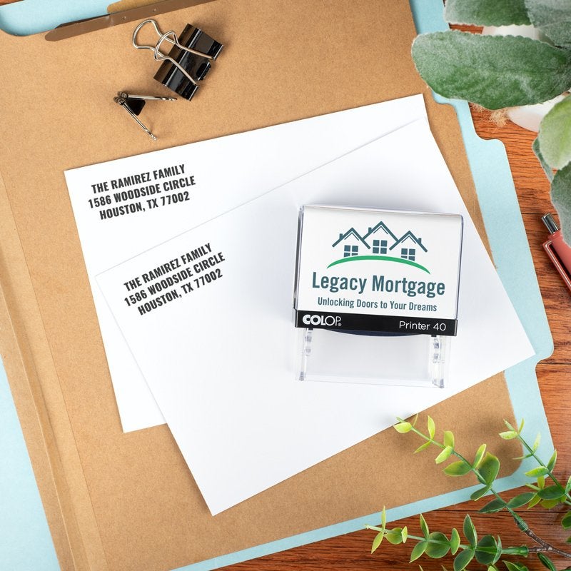 Address stamp for a company called Legacy Mortgage with two stamp impressions on paper